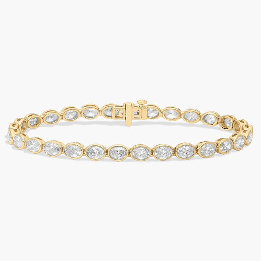 7 " Oval Cut Diamond E/W Bezel Set Tennis Bracelet In 14K Yellow Gold (8 Ct. tw. - H-I / SI1-SI2)